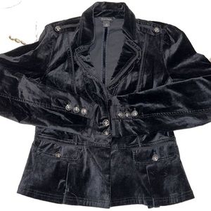 Felt material jacket with big studs on them. Good for a fancy night out!